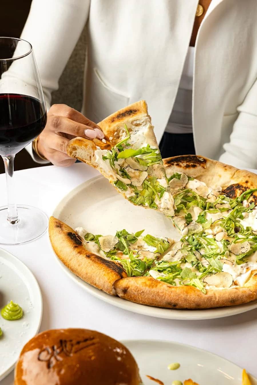Pizza al Tartufo — wood-fired with shaved black truffle